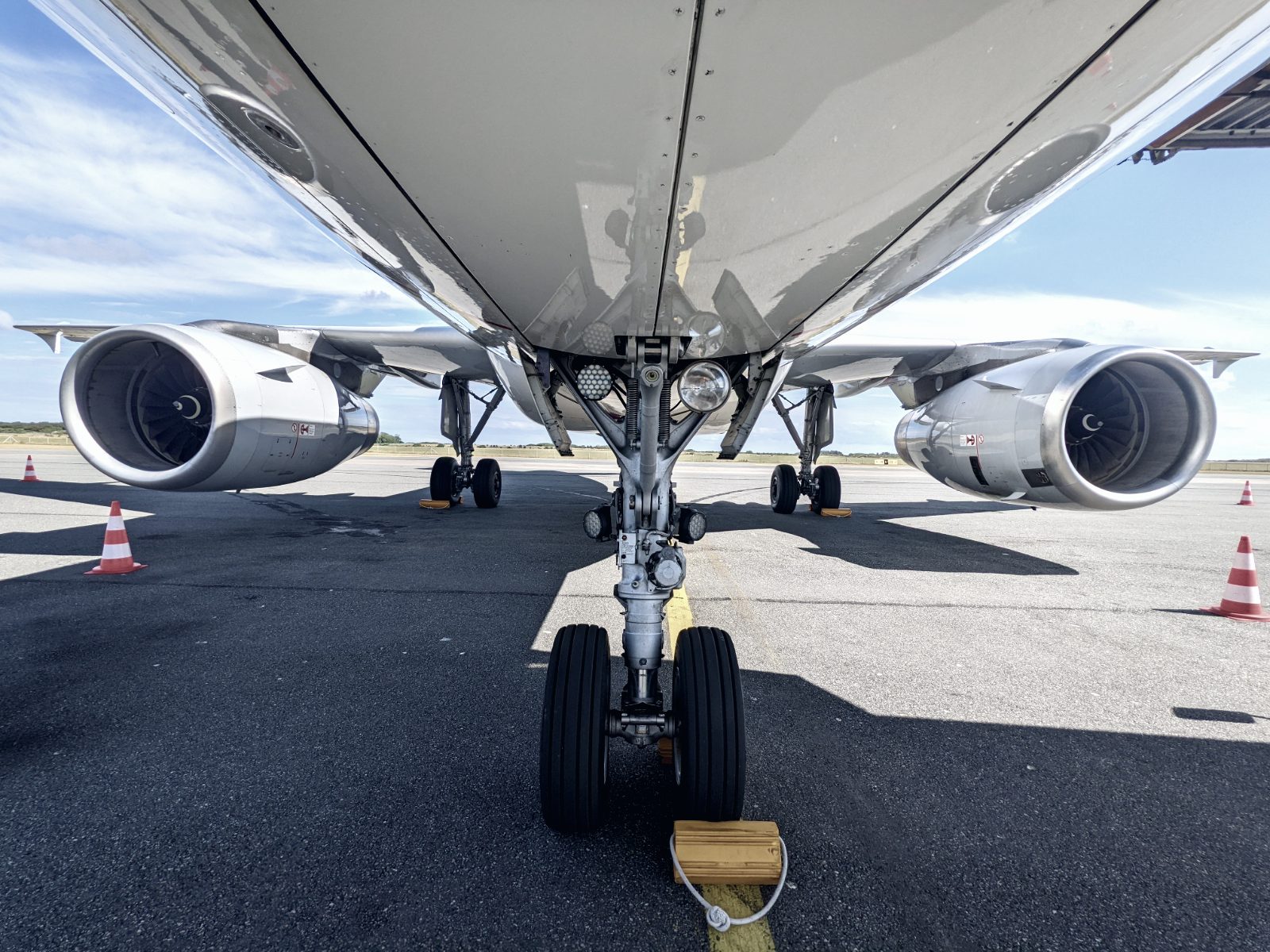 Under the aircraft on the stand